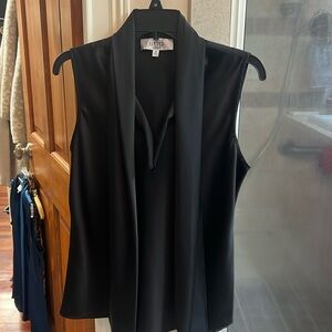 Sleeveless layering top.  Can be worn alone or layered with a jacket.